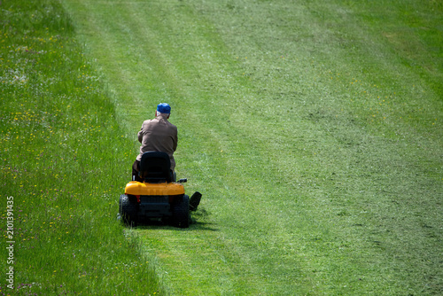 mowing the lawn with a self-propelled lawnmower