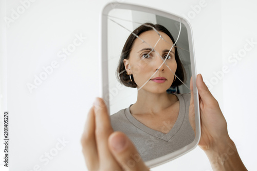 Konstfotografi Vulnerable mid-adult lady experiencing identity dissociation or psychological bu