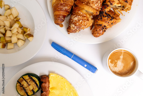 Peptide GLP-1 nsulin injector pen like ozempic on a breakfast table with high protein food, coffee and croissants, Top view, flat lay