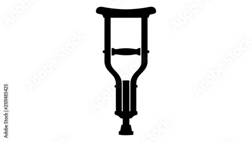 Bild auf Leinwand Crutch silhouette stands as a symbol of physical rehabilitation and mobility support for patients recovering from leg injuries