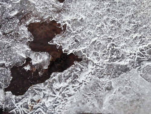 Broken Ice Sheet with Frost Crystal Patterns Over Dark Stone, Frosted Winter Nature Abstract Macro