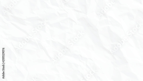 Crinkled white paper texture with folds and creases on a smooth surface