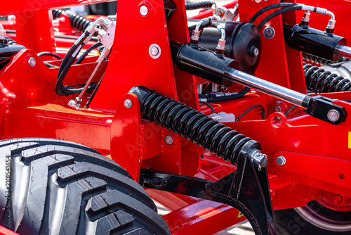 Cuadro en lienzo Agricultural machinery hydraulic cylinder and chassis tension spring