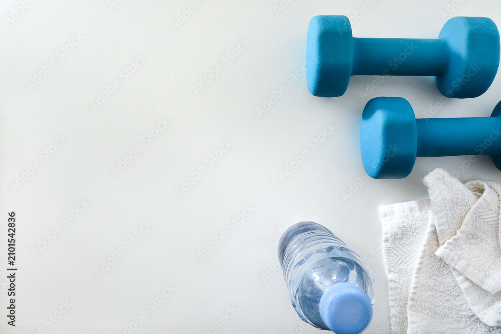 Obraz premium Blue Dumbbells with Towel and Water Bottle