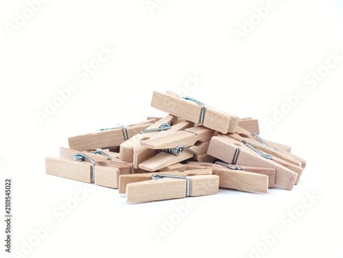 Canvastavla pile of classic wooden clothespins (clothes pegs) with metal springs, isolated on a clean white background