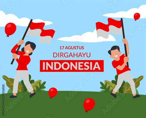 Indonesian youth raise the red and white flag in the field on Indonesian Independence Day August 17th