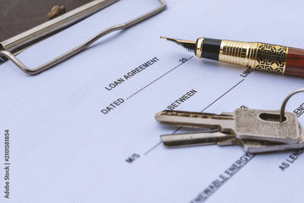 Fototapeta premium Loan Agreement with House Keys and Fountain Pen for Mortgage and Lending Concept