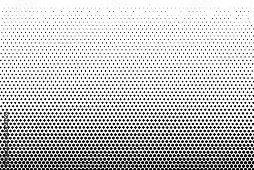 Fotografie Halftone gradient pattern with fading dots on a white background