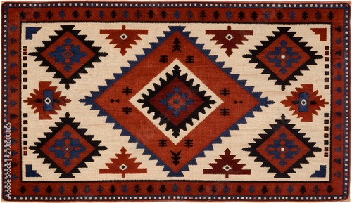Handwoven Moroccan rug with geometric diamond patterns. Traditional Berber carpet featuring bold red, blue, and beige tribal designs.
