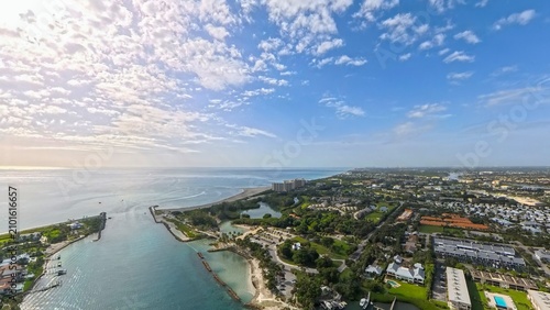 Coastal Gateway: High Aerial View of Jupiter Inlet, Rock Jetties, and Surrounding Beaches, Florida