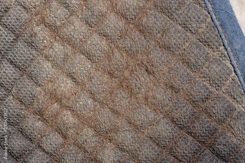 Cuadro en lienzo The underside of a horse saddle cloth showing sweat, grease and hair from the horse