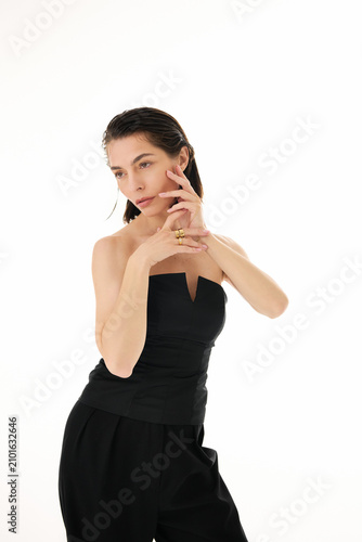 Фотография Chic elegance radiates as a stylish woman poses with finesse and grace