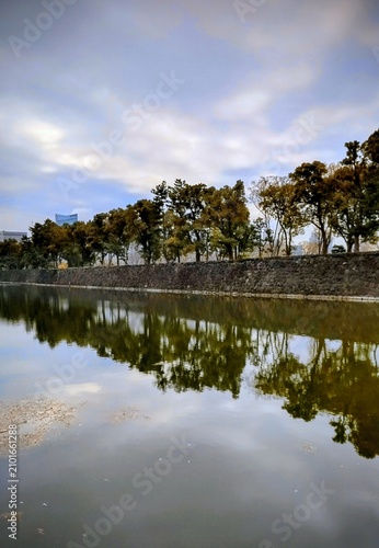 A landscape photograph of a japanese castle moat