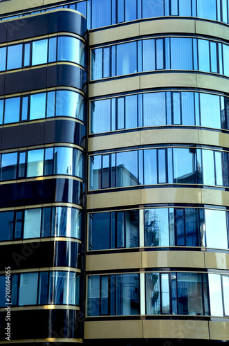 Closeup of modern building with shiny blue glass facade