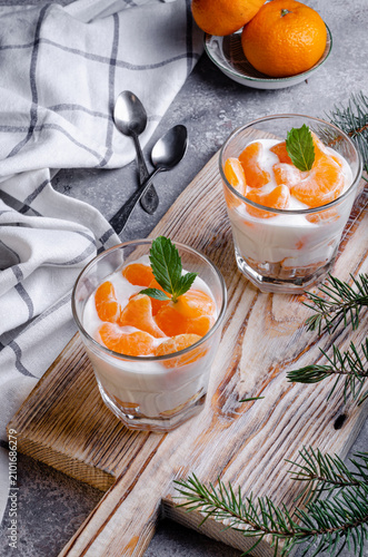 Cuadro en lienzo breakfast with orange, tangerine dessert, creamy dessert with tangerines in a gl