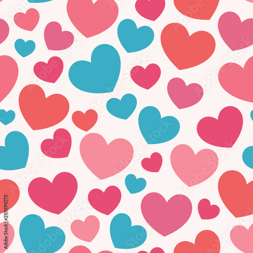 Seamless pattern with cute colorful pink, red, and blue hearts on a light background.