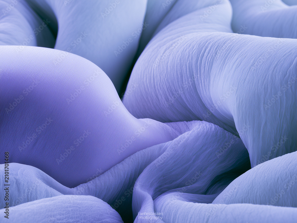 Obraz premium Close Up View of Intertwined Puffy Lavender Purple Fabric Tubes Minimalist Futuristic Soft Material Textures and Geometric Wave Design
