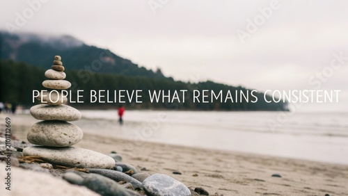 Peaceful beach scene with stacked stones symbolizing balance and tranquility in nature with soft colors and serene atmosphere