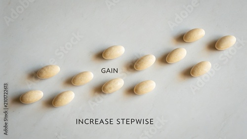 Visual Representation of Gain and Incremental Progress with Pebbles on a Smooth Surface for Business and Growth Concepts
