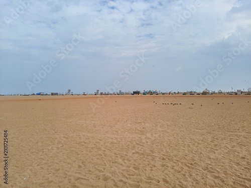Принти на полотні Wide perspective view of sandy seashore at low tide with seashore landscape dayl