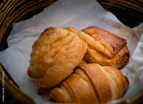 Three croissants in a bamboo basket, Paris, France