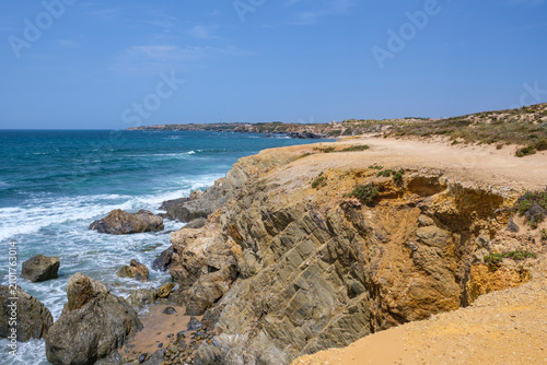 Rugged Rocky Cliffs and Sandy Dunes on the Atlantic Coast near Vila Nova de Milfontes, Alentejo, Portugal