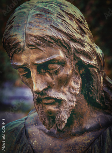 Photography Bronze statue of Jesus Christ with bowed head in prayerful contemplation