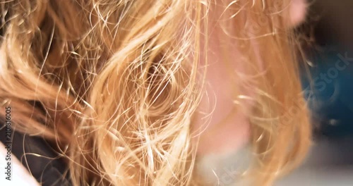 A teenage girl with loose hair eats noodles with her hands and drinks a shake. A quick snack, back to school_