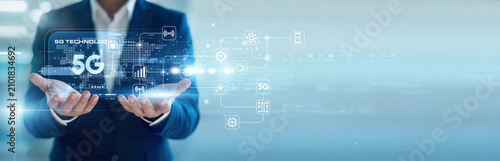 Photography IT specialist handhold virtual screen showcasing 5G Technology network speed while working on laptop for seamless connectivity