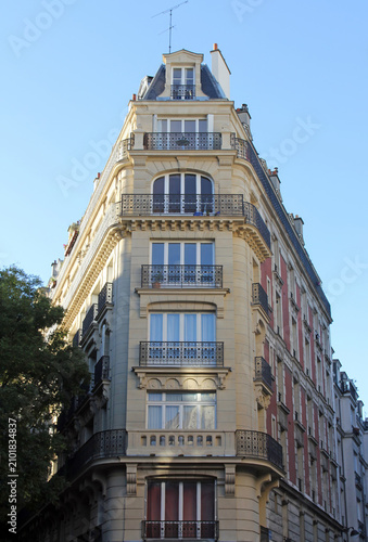 Facade of a traditional apartment building in Paris, France