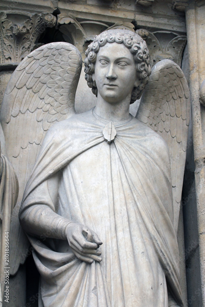 Fototapeta premium Angel, Notre-Dame cathedral, portal of the Virgin, Paris