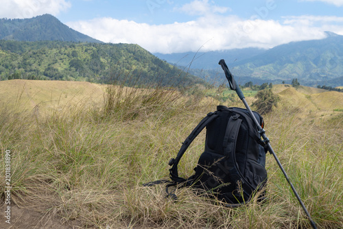 Nature's Serenity: Captivating Landscape With Hiking Backpack and Majestic Mountains in the Background