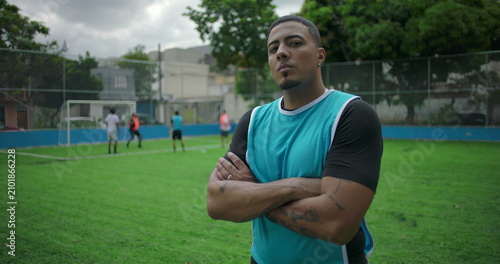 Canvastavla Latin Hispanic man of African descent crossing arms confidently on urban soccer