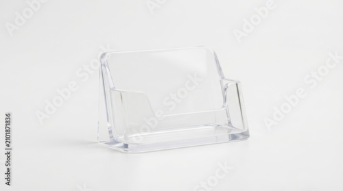 Clear acrylic business card holder isolated on clean white background for office supplies