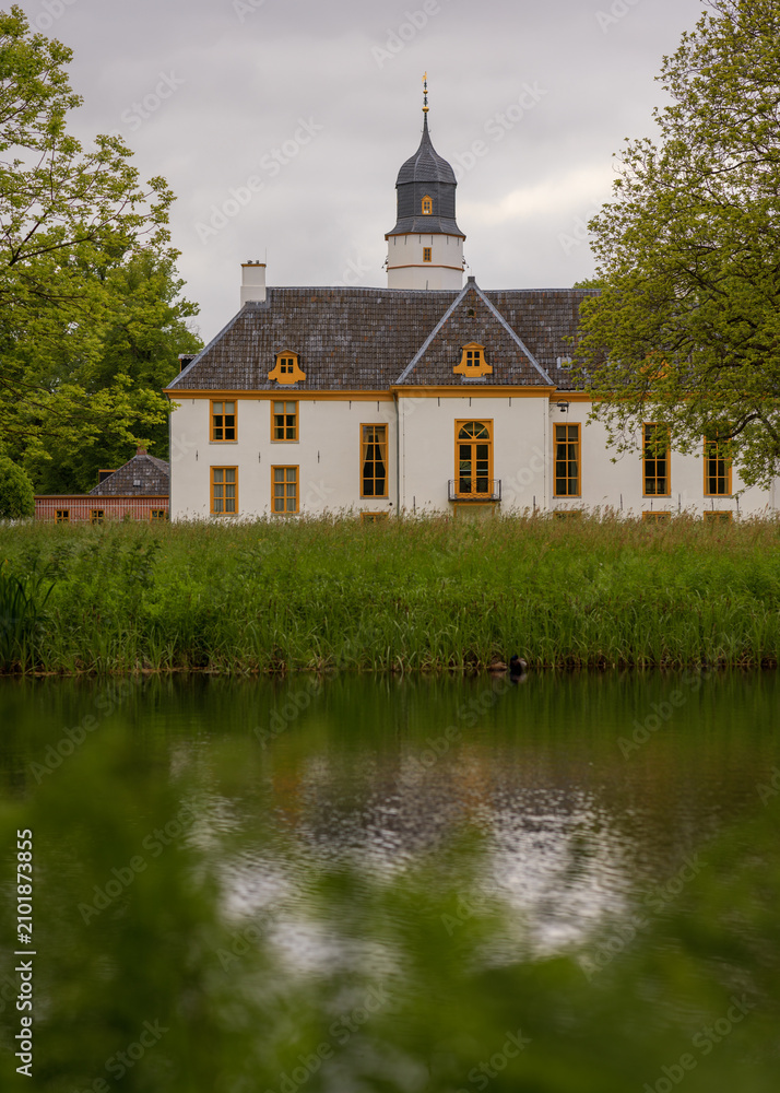 Fototapeta premium Romantic view at the backside of noble house Fraeylemaborg at summer