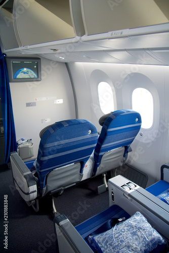 Warsaw, Poland, May 10 2018: Premium economy seat with blanket and pillow prepared for passengers