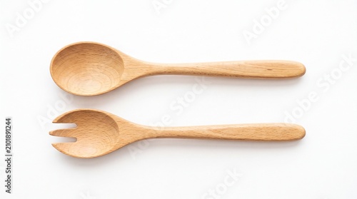 Two natural wooden kitchen utensils for serving salad placed horizontally isolated on white background