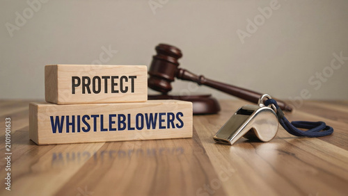Protect Whistleblowers Legal Concept with Judge Gavel and Whistle on Desk