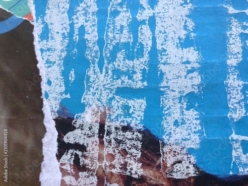 Blue and white torn street poster collage with weathered ripped paper layers and grunge textures