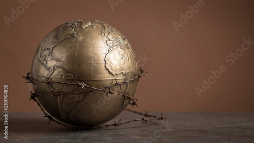 Barbed Wire Wrapped Globe Symbolizing Global Conflict, Crisis, and Geopolitical Tension