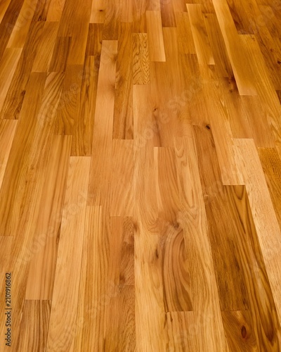 Polished warm amber hardwood flooring parquet panel texture background
