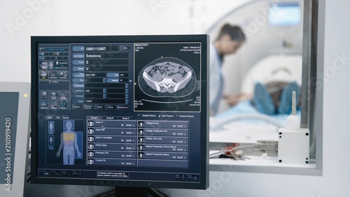 Obraz na plátne Computed tomography workstation displaying diagnostic imaging during CT examinat
