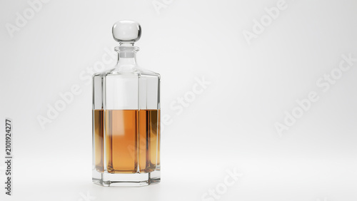 Faceted glass decanter filled with amber liquid on a clean white background bottle