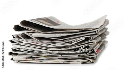 Stack of Newspapers on White Background description