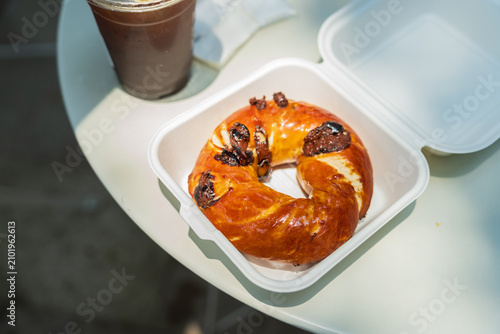 Glossy Bagel In Takeaway Box With Drink