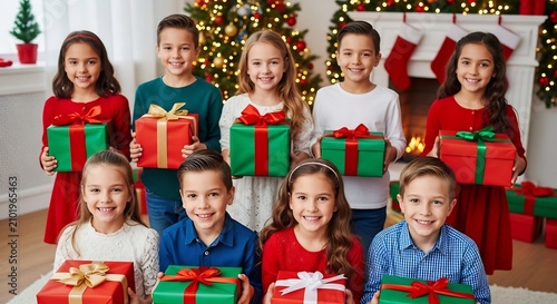 Group of happy young children holding wrapped Christmas gifts in a festively decorated room with a tree.