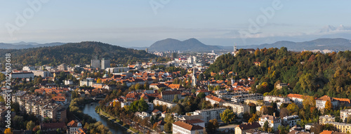 Panorama aerial view of Ljubljana, Slovenia capital city, highlighting the skyline, Ljubljanica river and old castle.