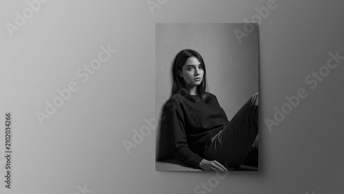 Woman sitting on floor in black and white portrait style  