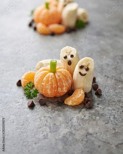 Whimsical halloween fruit snack ideas mandarin pumpkins and banana ghosts for kids' parties