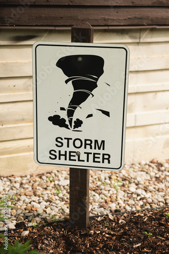 Konstfotografi A storm shelter sign featuring a tornado symbol marks the location of an emergency shelter for severe weather events